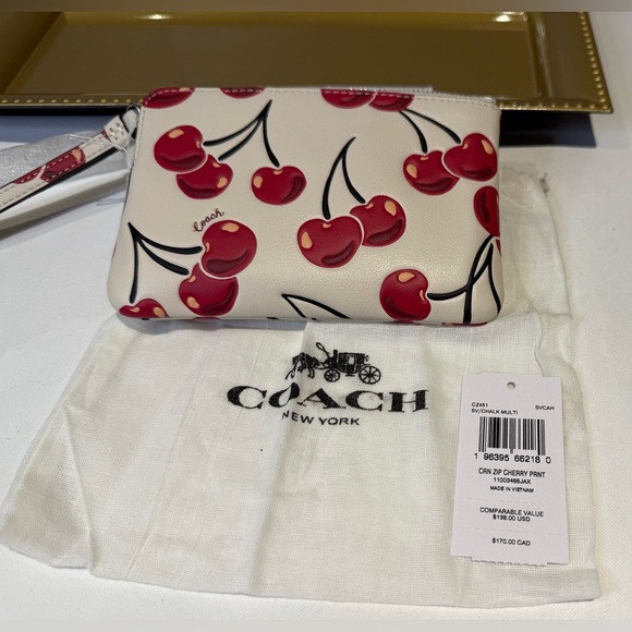 Coach Handbags - Coach Red Cherry Pattern Wristlet Comes with Dust bag